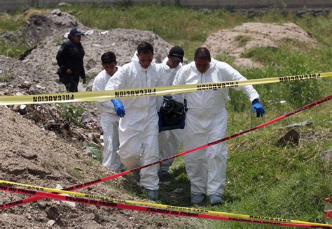 Mexican volunteer searchers find 27 hacked-up bodies in northern border city
