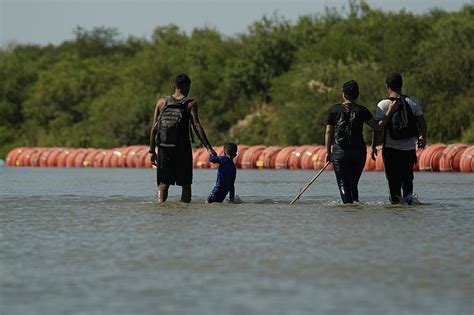 Mexico recovers body of Honduran migrant in Rio Grande; another body found near floating barrier