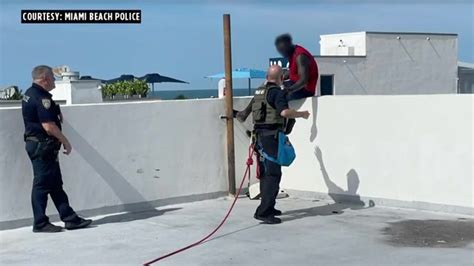 Miami Beach Police intervention specialists coax man threatening suicide off roof edge