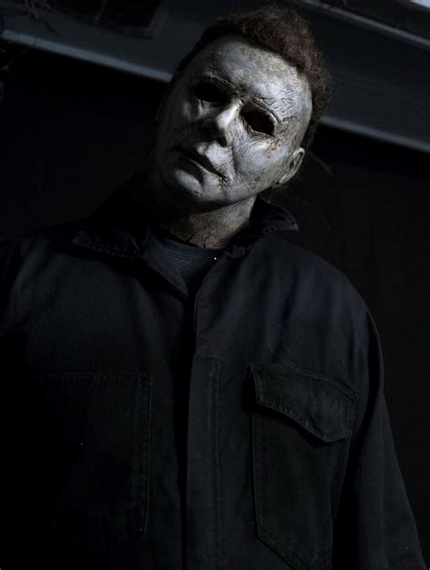 Creepy scene from Halloween Resurrection where Michael Myers stares out the window during the daytime.. 