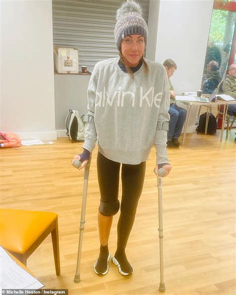 Michelle Heaton hobbles on crutches after injuring herself during ...