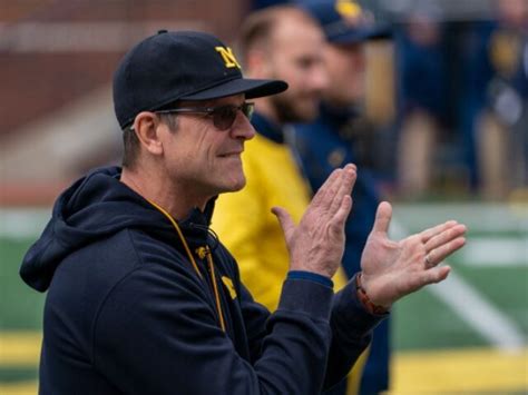 Michigan’s Jim Harbaugh says he would take less salary if it meant college athletes would be paid