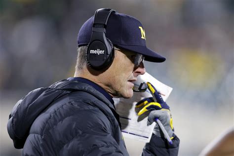 Michigan is accused of stealing other team’s signs. Here’s why its coach just got banned for 3 games