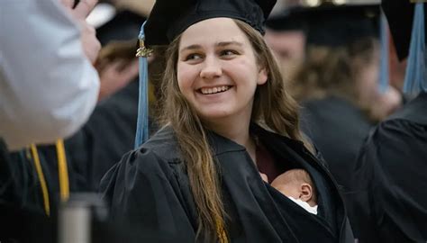 Michigan mom graduates college with 10-day-old baby girl tucked in gown