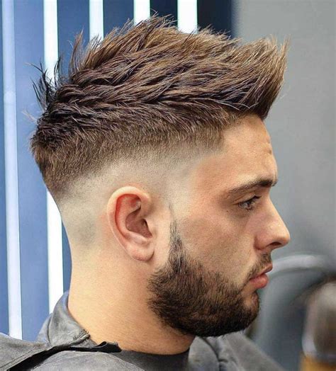 1. Faux Hawk Fade. Also known as the “fohawk fade,” you’ll need fading haircut skills to get this look. With a faded style like the high and tight fade or a low fade, you can create all kinds of faux hawk looks that blend or separate from your long hair on top. High fade fohawk (left) and low skin fade faux hawk (right). 2. Messy Faux Hawk. 