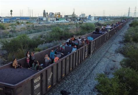 Migrants hoping to reach US continue north through Mexico by train amid historic migration levels