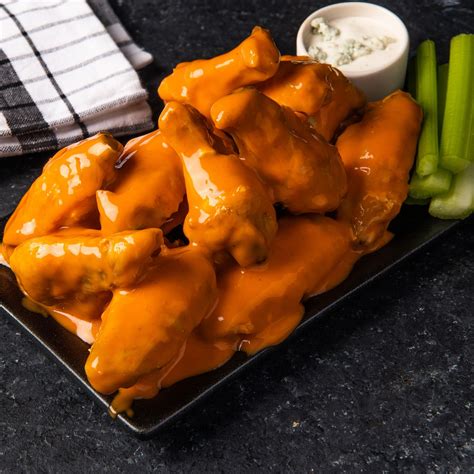 Mild wings. Directions. Cut whole wings at joints and discard wing tips. Place the 24-30 pieces on absorbent paper to dry. Fry: 375° F 10-12 minutes or until crispy. Oven Bake: Spread wings in a single layer on sheet pan. 450° F for 35 min or until done. To coat, place cooked wings and Texas Pete® Buffalo Wing Sauce in a large covered … 