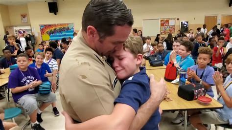 Military dad surprises children with reunion at school