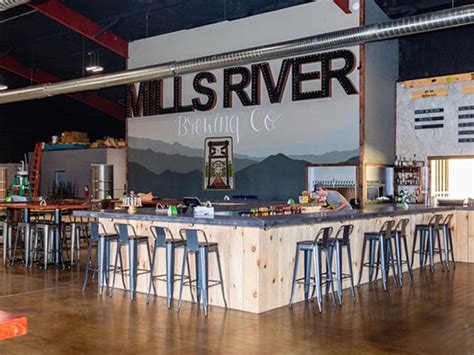 Mills river brewery. Joey and PJ founded the business on 2014 starting their 1st location in a tiny strip mall location. In January of 2020 they opened the Mills River Brewing Co in the heart of Mills River NC. Specialties. Mills River Brewing Company is located in the heart of Mills River. Family owned and operated since 2015. 