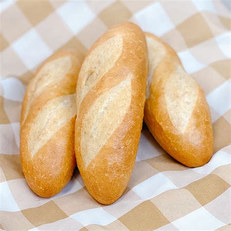 Mini baguette. Pour into a pie dish or shallow baking pan. Soak the bread slices in the egg mixture for about 2 minutes on each side. Meanwhile, over medium-low heat, melt 1 Tablespoon of butter in a skillet. Place however many slices of bread fit into the pan and cook until golden brown on each side, about 3 minutes on each side. 
