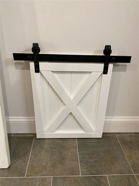 Mini barn doors for cabinets.  H&auml;fele is a valuable partner for cabinet...