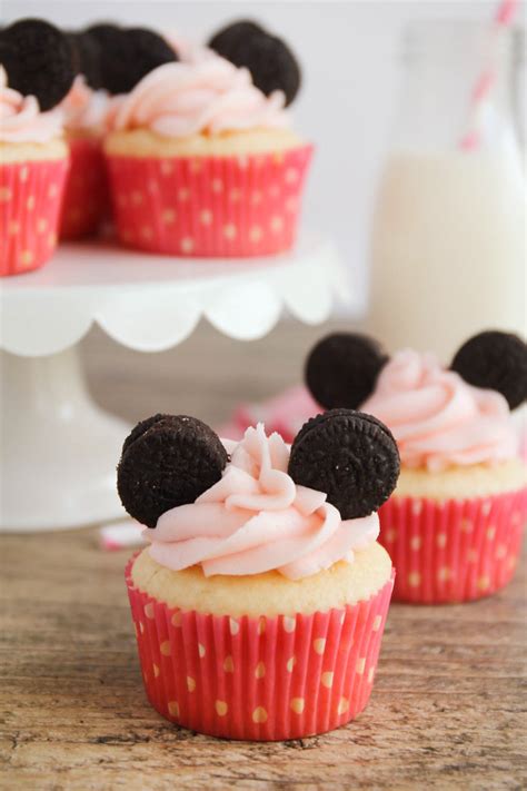 Minnie mouse cupcakes. Preheat oven to 350. Line cupcake pan with the cupcake liners. In a medium bowl, add the cake mix, butter, milk and stir until combined. Fill cupcake liners 3/4 of the way full. Bake in the oven for about 21 minutes. Pull out the cupcakes and allow to cool before frosting. 