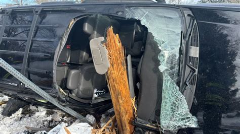 Minor injuries after light pole snaps, ends up in passenger seat in rollover crash
