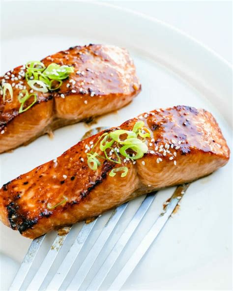 Miso glazed salmon recipe. Preheat oven to 375F. Place marinade ingredients in a very small bowl and whisk. On a parchment -lined sheet pan, to one side, place the spring peas and snap peas. Pat the salmon dry and brush liberally with the marinade on all sides, spooning a little extra over the top. Season the salmon with salt and pepper. 