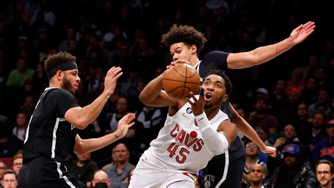 Mitchell has big slam, 31 points as Cavs beat Nets 115-109