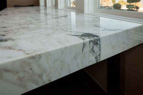 Mitered edge countertop. Both Dekton and quartz countertops cost about the same price at $45 - $120 per square foot installed. Dekton prices go from $55 - $115/sq. ft. with and average around $65 - $95/sq. ft. installed. Quartz costs ranges from $45 - $120/sq. ft. with an average between $65 - $85/sq. ft. installed. So, very similar. 