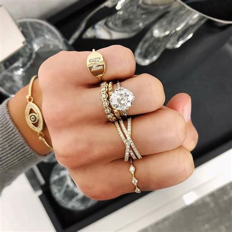 Mixed metal ring. Recreate this gorgeous ring stack yourself that features white gold, yellow gold, and diamonds galore. From top to bottom: Micro-Prong Diamond Ring (LB115) - $1,425 in 14k White Gold. Micro-Prong Diamond Ring (FG60B) - $975 in 14k Yellow Gold. Shared-Prong Diamond Band (LB62) - $4,350 in 18k White Gold. 