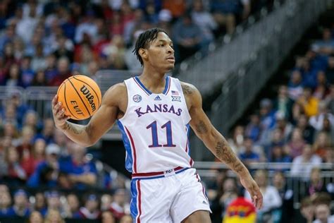 Kansas Jayhawks guard MJ Rice (11) sets the play during the first half against the Texas Longhorns at T-Mobile Center in Kansas City on March 11, 2023. William Purnell USA TODAY Sports. 