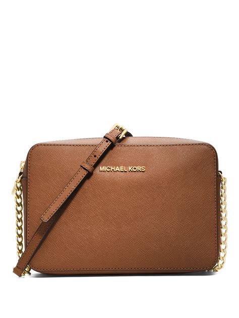 Expertly crafted with premium materials, the MK Crossbody with Wallet offers the perfect combination of style and practicality without breaking the bank. With its sleek design and high-quality construction, this crossbody bag will elevate any outfit while providing ample space for all your essentials. Add this must-hav