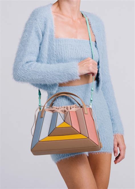 Mlouye bag. Fashion. This Independent Handbag Label Won Over Hailey Bieber With Its Sculptural Designs. By Alice Cary. 11 December 2021. Courtesy of Mlouye. 