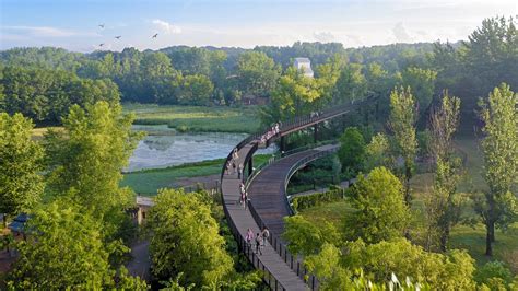 Mn zoo treetop trail. As AN reported, ground broke on the 1.25-mile-long trail last year. $39 million in combined public and private funding supported the project, which opened on schedule on July 28. The trail loops ... 