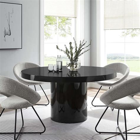 Modern black dining table.  &copy; ModernOptical.  Something that is modern is ne...