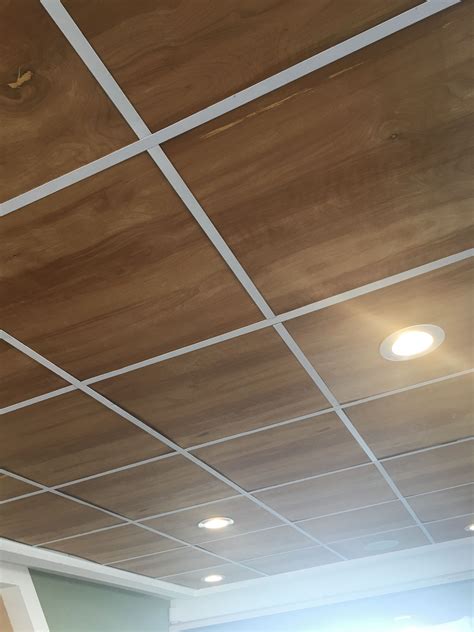 Modern drop ceiling. Suspended ceilings are ceilings that are suspended from the roof, or concrete slab overhead. The ceiling are suspended using steel suspension rods, the suspension drop varies from approximately 300mm to 900mm. These ceilings are easy to customise to suit the space, and great for large spaces, such as offices, showrooms, and warehouses. 
