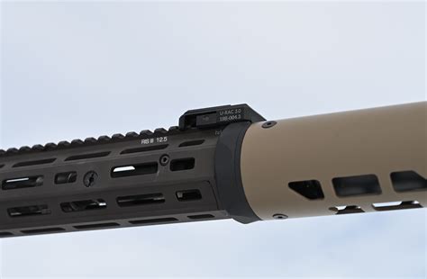 Modtac suppressor cover. I like the silencerco height temp covers. Have a no ex (I think) sleeve internally. The Velcro straps work better for me than any of the cinch down covers like in this pic. They always seem to work their way off quickly. Have sent a couple off them down range. 