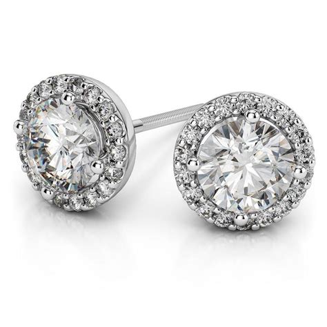 Moissanite stud earrings. Moissanite carat weight is expressed in diamond equivalent weight, gram weights are based on 14k gold. All prices are in USD. Earrings are sold in their total carat weight. Choosing a 2.0ct tw means every earring will be 1.0ct. 14k rose gold and platinum are ONLY available with friction or locking posts/backs. 