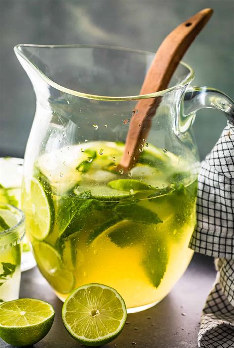 Mojito pitcher. An average beer pitcher contains 64 ounces of beer, which equals four pints or 5.25 12-ounce mugs. Beer cans usually hold 12 ounces of beer and bottles hold about 11 oz, so drinkin... 