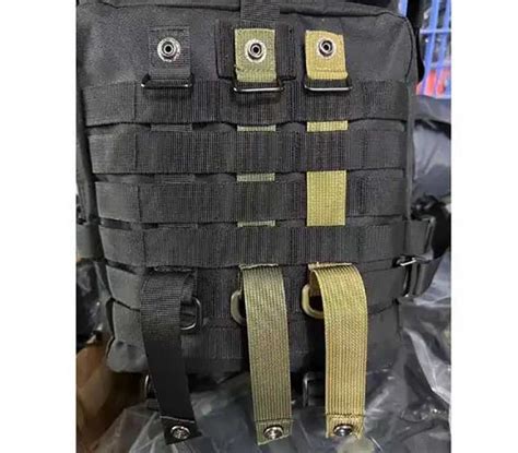 Molle webbing straps.  The pouch itself is securely fastened to the MOLLE base through ...