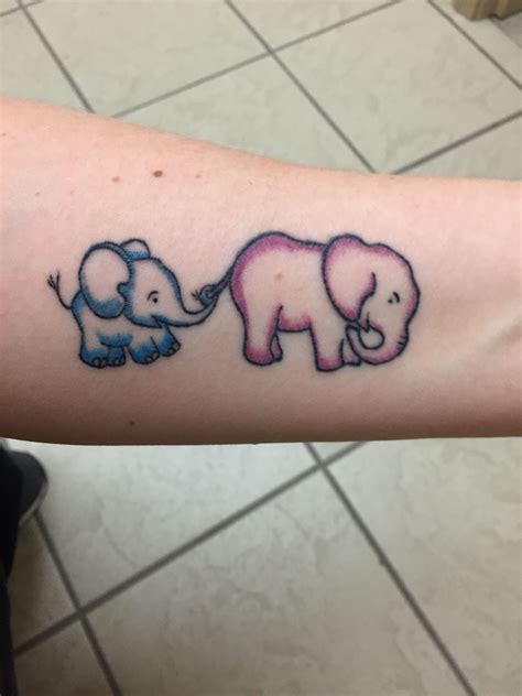 Try a Temporary Tattoo. These realistic elephant tattoos show the mother elephant and the baby walking together the baby elephant has held its mother’s tail with its trunk. The entire tattoo is made in a very cute manner. This tattoo can also be called a cute cartoon elephant tattoo. The baby elephant tattoo is made in such a way that it is .... 
