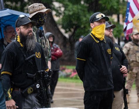 Moms for Liberty removes two Kentucky chapter leaders who posed with far-right Proud Boys
