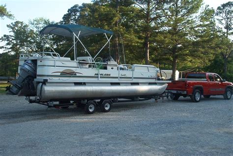 Monark pontoon boat. 2005 Monark 246 seville, 2005 Monark 24 ft pontoon50hp Mercury New coverNew bimini New carpetMeticulously maintained by Long Lake MarineSony stereo with amp, subwoofer and JL Audio speakersBeen a great boat for our family.Clean title in hand.Located in Hale (between Tawas and West Branch)A very nice pontoon for the money. $11900 