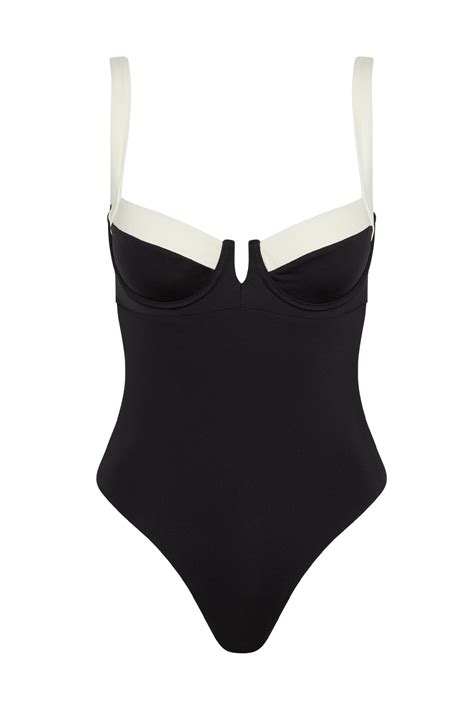 Monday swimwear. Compliment worthy The Sardinia One Piece is a well-fitted and timeless one piece made for you. Featuring a chic silhouette, this classic one piece is complete with a flattering square neckline, open back, high leg and moderate coverage.Features:Square necklineOpen backHigh legModerate bottom coverageCare:Click here for 