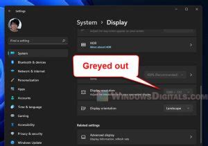 Monitor greyed out in display settings.  Change the screen resolution via your graphics card...