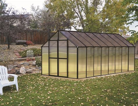 Monticello greenhouse. Integrated flush base design. High impact UV stable 8 mm twin wall polycarbonate walls and roof. Heavy duty extruded aluminum frame construction. Electrostatically painted black frame. Two - 2 ft. x 2 ft. roof vents with automatic openers. Integrated dual rain water gutter system. Large 6 ft. 10 in. x 4 ft. 6 in. wide door opening. 