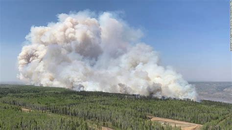 More than 29,000 people are evacuated from communities throughout Alberta as wildfires rage in Canada