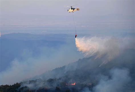 More than 600 firefighters backed by water-dropping aircraft struggle to control wildfires in Greece