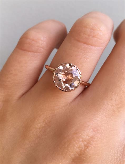 Morganite engagement ring. Feb 12, 2024 · Best Morganite Engagement Ring – Bottom Line Up Front: If I had to select just one morganite engagement ring from Brilliant Earth, it would be this Comfort Fit Morganite Engagement Ring. This ring features a sleek but classic solitaire style, with a beautiful but simple shank that showcases the beauty of the morganite gemstone. 