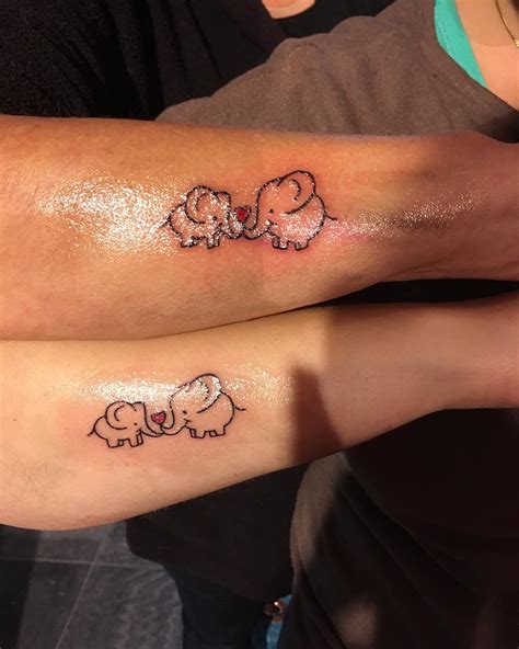 Mother 2 daughters tattoos. Cool Wrist Tattoos. Leg Tattoos Women. Elephant Head Tattoo. Elephant Family Tattoo. Originally designed in Thunder Bay Ontario. Red River Trade Co. Mom with her two children. Angela Miller. Jun 9, 2022 - This Pin was created by Kelly Le on Pinterest. Mother of two ♥️. 
