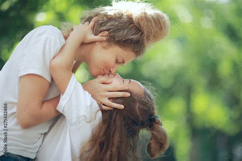 Mother Kissing Child Lips Pictures, Images and Stock Photos