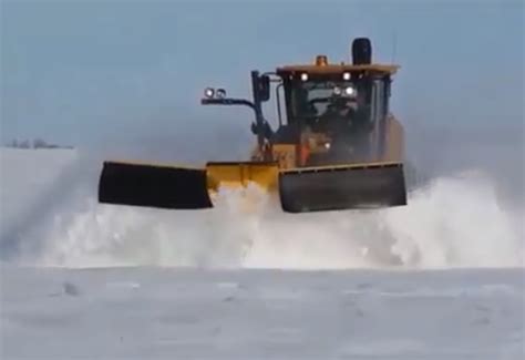 Motor grader snow plow.  The versatility of front mounted snow plows make t...