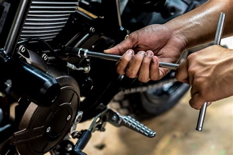 Motorcycle maintenance. Lather the motorcycle with your motorcycle cleaning spray or automotive soap, working from the top to the bottom of the bike and making sure not to rub too vigorously. Use a soft bristle brush for areas like the chain and the wheels. Rinse off the lather immediately so it doesn’t leave streaks and spots. 