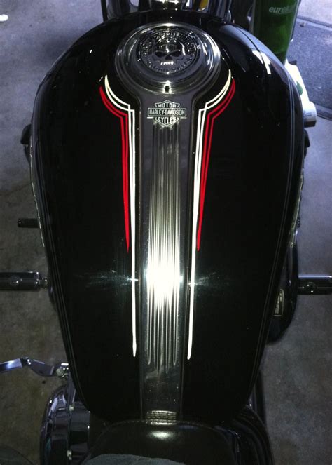 1928 Chevy Fender Pinstripes. 1938 Ford Wheel Well Stripes. 1955 Chevy Wheel Well Stripes. 1936 Ford Pinstripes. Pinstripes and Broadlines. Pinstriped Trash Can. Harley Flame Set. Pinstriping at a bike show. 1951 Mercury. 1925 Buick, stripes on hood louvers and wooden spokes. Indian Motorcycle Tank. Stripes on a saddle bag lid