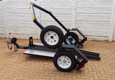 Stinger XL 112 Folding Motorcycle Trailer – Specifications: • Capacity: 1 Motorcycle up to 112” long (when trailer is fully extended) • Color: Black • Weight: 320 lbs • Weight Capacity: 3180lbs • Trailer Light Connector: 4-way flat • Folded Measurements (W x D x H) : 54.25”x 27”x 49” • Unfolded Measurements (L x W) : 141.5”(112” usable) x 54.25” • Stands up for ....