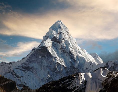 Mount -t. Aerial view of Mount Everest from the south. The peak rises over Lhotse, while Nuptse is the ridge on the left.. There are at least 108 mountains on Earth with elevations of 7,200 m (23,600 ft; 4.5 mi) or greater above sea level.Of these, 14 are more than 8,000 m (26,000 ft; 5.0 mi). The vast majority of these mountains are located on the edge of the Indian and … 