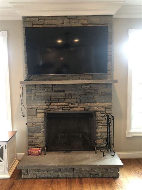 Mounting tv on stone fireplace. Conclusion. In conclusion, finding the optimal height for mounting your TV over a fireplace is crucial for your viewing pleasure. It requires careful consideration of viewing distance, eye level, and the size of your TV. The recommended height is typically between 42-58 inches from the floor to the center of the screen. 