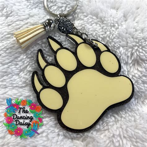 Moxie Vinyls makes unique and popular acrylic blanks in many shapes for glitter vinyl keychains, ornaments, badge reel and jewelry crafts. Ready to decorate with our collection of beautiful pattern printed adhesive vinyls. We also offer printed HTV heat transfer vinyls and accessories for your personalized keychains.. 
