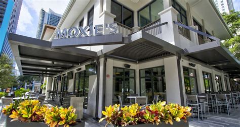 Moxies restaurant. Moxies restaurant is a contemporary casual restaurant offering a globally inspired menu and hand crafted cocktails in a vibrant and interactive atmosphere. Moxies has over 50 locations across Canada and 6 US locations in Dallas, Houston, and Miami.Moxies is located at Gloucester Centre, just steps … 